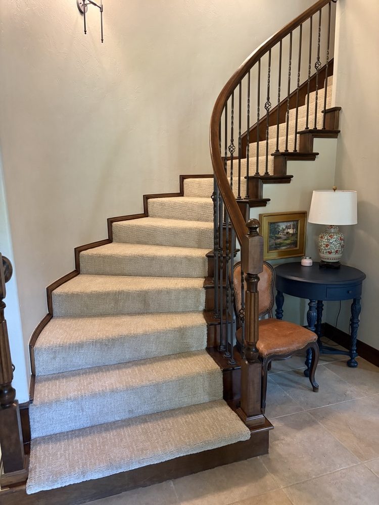 New light carpet runner on a curved staircase